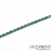tennis bracelet with natural emeralds and diamonds in 18kt white gold