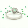 white gold heart rings with brilliant diamonds and emeralds