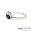 trilogy ring with sapphires and diamonds in 18kt white gold