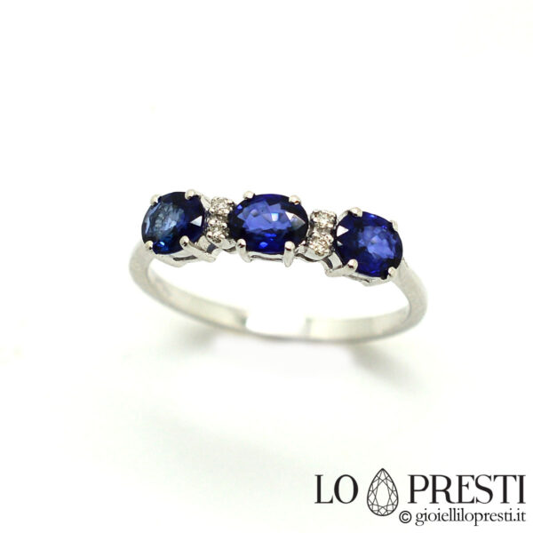 18kt white gold trilogy ring with sapphires and diamonds