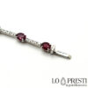oval cut red rubies tennis bracelet with brilliant cut diamonds
