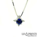 Necklace with very bright pendant with sapphire and diamonds.