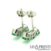 18kt white gold earrings with emeralds and trilogy diamonds