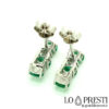 trilogy earrings with emeralds, diamonds, white gold and butterfly stud closure