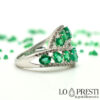 gold-band-ring-entwined-with-emeralds-and-diamonds