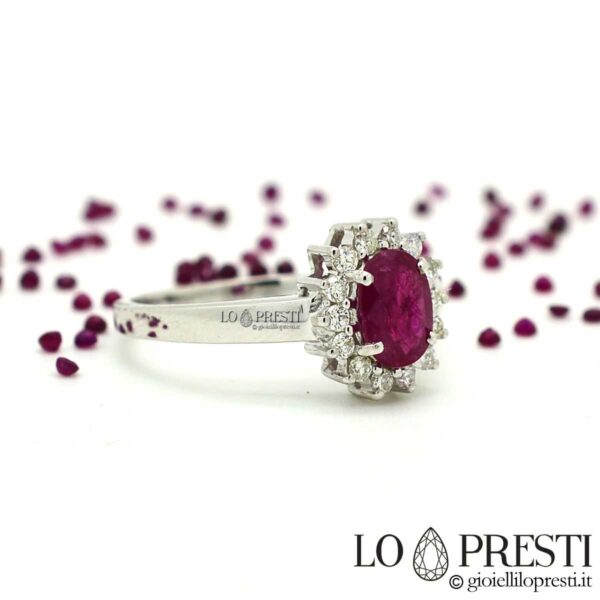 ring with oval cut ruby ​​surrounded by brilliant cut diamonds in 18kt white gold
