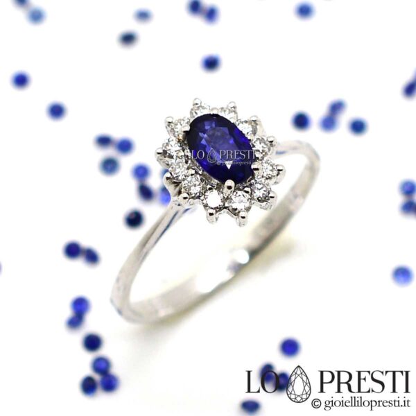 ring with blue sapphire and diamonds in 18kt white gold