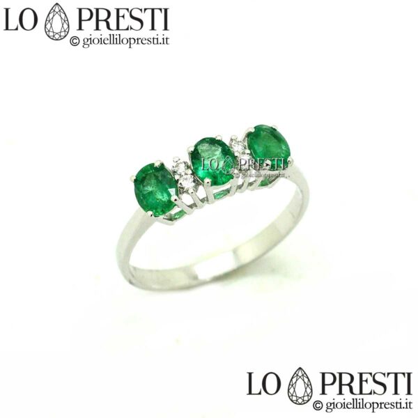 emerald trilogy ring with diamonds emeralds white gold
