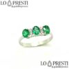 trilogy ring with diamonds, emeralds, 18kt white gold