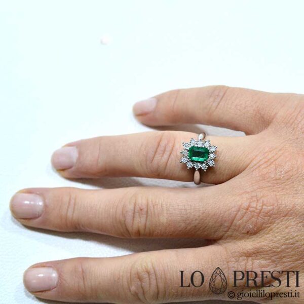 Ring with natural emerald and certified brilliant cut diamonds. A timeless jewelery classic.