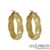 Yellow gold hoops, with bayonet closure, polished and diamond-cut - max barrel width 1,00 cm