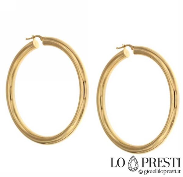 Polished circle bushes in 18kt yellow gold