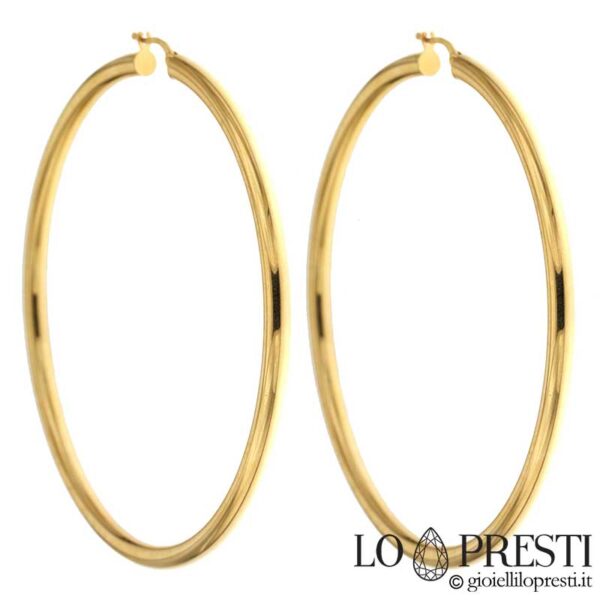Large polished hoop bushes in 18kt yellow gold