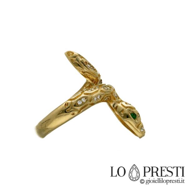 Snake ring in 18kt yellow gold with white and green zircons, refined workmanship for this design object. Lifetime guarantee certificate.