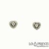 Heart design earrings in 18 kt white gold with natural brilliant cut diamonds, closure made up of pin and butterflies. A timeless jewel ideal for remembering an important moment.