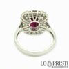 Eternity ring with 100% natural Mozambique ruby ​​of a beautiful color surrounded by natural brilliant cut diamonds and baguettes in 18kt white gold. Warranty certificate and gift box.