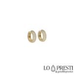 Hoop earrings in 18 kt yellow gold with prong setting and zircons