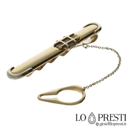 18kt white and yellow gold tie clip with satin finish. Certificate of guarantee and gift box.