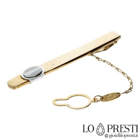 18kt white and yellow gold tie clip with satin finish. Certificate of guarantee and gift box.