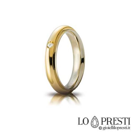 Unaerre Andromeda model wedding ring in 18 kt white and yellow gold with brilliant-cut diamond, customizable via internal engraving. Product available only on order. Warranty certificate and gift box.