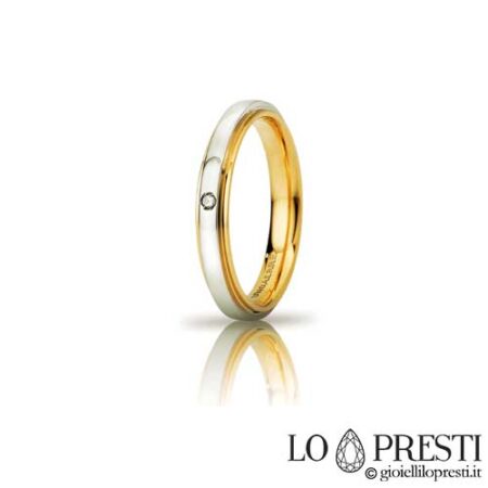 Unaerre カシオペア スリム モデルの結婚指輪。ブリリアント カット ダイヤモンドをあしらった 18 Kt ホワイト & イエロー ゴールド製。内側の彫刻でパーソナライズされています。