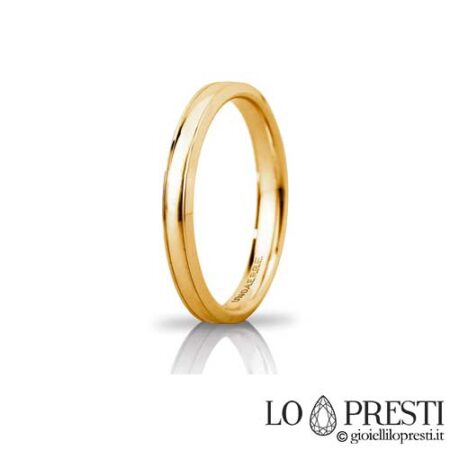Unaerre Orion slim wedding ring in 18 kt white or yellow gold, customizable via internal engraving. Product available only on order. Warranty certificate and gift box.