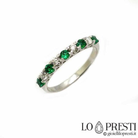 Band ring with natural emeralds and brilliant cut diamonds